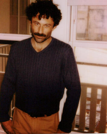Hogan Ellis press portrait Hogan Ellis standing on a balcony in the definitive Kingdom of Forgetting press portrait
