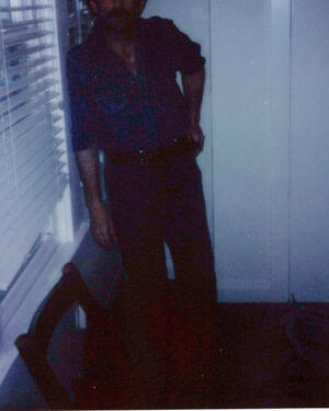 Hogan Ellis Hogan Ellis in blue light beside a window